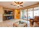 Gorgeous living room area with fireplace and lots of natural light at 20742 E Mockingbird Dr, Queen Creek, AZ 85142