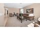 Spacious living room with plush carpet, neutral tones, and traditional furnishings at 20742 E Mockingbird Dr, Queen Creek, AZ 85142