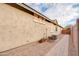 Side yard features a brick walkway, rock landscaping, and the exterior of the house at 20742 E Mockingbird Dr, Queen Creek, AZ 85142