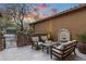 Secluded back patio with comfortable seating, a fountain, and a private gated entrance at 20750 N 87Th St # 1137, Scottsdale, AZ 85255