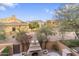 Backyard view with fireplace, desert landscaping, and sunny skies at 20750 N 87Th St # 1137, Scottsdale, AZ 85255