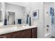 The bathroom vanity showcases a pristine countertop and well-lit mirror with an adjoining shower-tub at 20750 N 87Th St # 1137, Scottsdale, AZ 85255