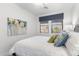 Cozy bedroom featuring modern decor, natural light, and a comfortable queen sized bed at 20750 N 87Th St # 1137, Scottsdale, AZ 85255