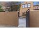 Private courtyard entrance featuring pavers, an outdoor kitchen and gas grill, and custom exterior paint at 20750 N 87Th St # 1137, Scottsdale, AZ 85255