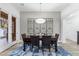 Elegant dining room with dark wood table, leather chairs, and stylish decorative wall art at 20750 N 87Th St # 1137, Scottsdale, AZ 85255