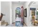 Bright foyer with an arched doorway, wood accents, and a glimpse of the front yard at 20750 N 87Th St # 1137, Scottsdale, AZ 85255