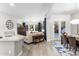 Bright living room with wood floors and an open design leading to the dining area and outdoor patio at 20750 N 87Th St # 1137, Scottsdale, AZ 85255