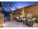 Inviting outdoor patio with comfortable seating, stone wall, and tranquil fountain feature at 20750 N 87Th St # 1137, Scottsdale, AZ 85255