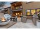 Entertainer's patio featuring an outdoor fireplace, waterfall, and BBQ, perfect for Arizona evenings at 20750 N 87Th St # 1137, Scottsdale, AZ 85255