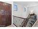 Staircase with neutral carpeting and iron railing with detailed woodwork at 20750 N 87Th St # 1137, Scottsdale, AZ 85255