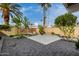 Backyard patio with pavers and well maintained trees and greenery at 212 W Interlacken Dr, Phoenix, AZ 85023