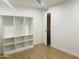 Bedroom featuring an open closet and modern floors for a clean and organized look at 212 W Interlacken Dr, Phoenix, AZ 85023