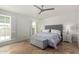 Cozy bedroom featuring neutral tones, a comfortable bed, and natural light from the window at 212 W Interlacken Dr, Phoenix, AZ 85023