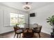 Bright dining room featuring modern lighting, table and chairs, and ample natural light at 212 W Interlacken Dr, Phoenix, AZ 85023