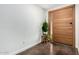 Modern entryway with stylish front door and plants adding a touch of nature at 212 W Interlacken Dr, Phoenix, AZ 85023