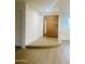 Inviting entryway featuring modern floors, half wall, and updated door at 212 W Interlacken Dr, Phoenix, AZ 85023