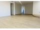 Bright living room boasts modern floors, neutral walls, and open floor plan ready for decor at 212 W Interlacken Dr, Phoenix, AZ 85023