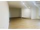 Bright living room boasts modern floors, neutral walls, with an open floor plan and recessed lighting at 212 W Interlacken Dr, Phoenix, AZ 85023