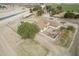 Aerial view capturing the expansive property with a home, trailer, and storage buildings at 21520 W Watkins St, Buckeye, AZ 85326