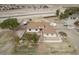 Aerial view of a sprawling ranch property featuring a home, trailer, outbuildings, and ample space at 21520 W Watkins St, Buckeye, AZ 85326