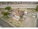 Aerial view of a well-kept property with a cozy home, patio, trailer, and plenty of room to roam at 21520 W Watkins St, Buckeye, AZ 85326