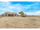 Spacious backyard with a trailer parked on the property, view of the home and covered patio at 21520 W Watkins St, Buckeye, AZ 85326