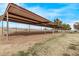 Large covered barn offering ample space for parking or storage on this sprawling property at 21520 W Watkins St, Buckeye, AZ 85326