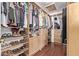 Walk-in closet with custom shelves and drawers at 21520 W Watkins St, Buckeye, AZ 85326