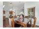 Cozy dining area with wood table and view to living area at 21520 W Watkins St, Buckeye, AZ 85326