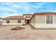 Charming single-story home features a landscaped yard and neutral colored exterior at 21520 W Watkins St, Buckeye, AZ 85326