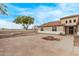 Beautiful home with a stylish desert landscape, featuring a decorative stone patio at 21520 W Watkins St, Buckeye, AZ 85326