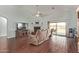 A spacious living room features wood tile floors and cozy furniture at 21520 W Watkins St, Buckeye, AZ 85326