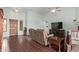 Inviting living room with wood tile floors, TV and cozy furniture at 21520 W Watkins St, Buckeye, AZ 85326