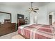 Bedroom with a ceiling fan, carpet flooring and a dresser at 21520 W Watkins St, Buckeye, AZ 85326