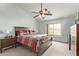 Bedroom with a ceiling fan, a window and carpet flooring at 21520 W Watkins St, Buckeye, AZ 85326