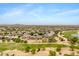 Sprawling desert community with lush landscaping, golf course, and mountain views at 21798 N Ingram Ct, Maricopa, AZ 85138