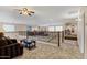 Open loft area with a view of the floor below, featuring comfortable seating and a stylish metal railing at 21798 N Ingram Ct, Maricopa, AZ 85138