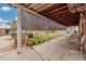 Covered back porch with outdoor seating, planters, and access to the backyard at 2230 N 14Th Pl, Phoenix, AZ 85006