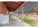 Wide view of the covered back porch looking out to a lawn with a washer and dryer at 2230 N 14Th Pl, Phoenix, AZ 85006