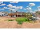 Spacious backyard with a grass patch, a swing set and a covered patio area at 2230 N 14Th Pl, Phoenix, AZ 85006