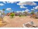 Open backyard with dirt ground cover, sparse foliage, and a few trees at 2230 N 14Th Pl, Phoenix, AZ 85006