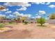 Large backyard with sparse landscaping, small trees and partial view of neighboring homes at 2230 N 14Th Pl, Phoenix, AZ 85006