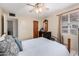 Bedroom features a neutral color scheme, tile flooring, and a ceiling fan at 2230 N 14Th Pl, Phoenix, AZ 85006