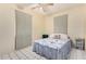 Cozy bedroom featuring a bed with a patterned quilt and bright curtains at 2230 N 14Th Pl, Phoenix, AZ 85006