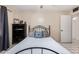 Bright bedroom featuring neutral walls, ceiling fan, and unique black iron bedframe at 2230 N 14Th Pl, Phoenix, AZ 85006