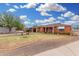 Single-story brick home with a well-kept lawn, covered porch, and inviting landscaping at 2230 N 14Th Pl, Phoenix, AZ 85006