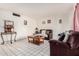 Inviting living room with neutral tile floors and comfortable seating arrangement at 2230 N 14Th Pl, Phoenix, AZ 85006