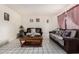 Comfortable living room with tile floors, dual sofas, and a stylish coffee table at 2230 N 14Th Pl, Phoenix, AZ 85006