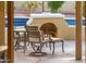 Inviting backyard with a cozy fireplace and outdoor seating at 23236 N Caleta Ct, Sun City West, AZ 85375