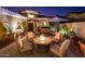 Stunning courtyard featuring a fountain, desert landscaping, and a fire pit with outdoor seating at 23236 N Caleta Ct, Sun City West, AZ 85375